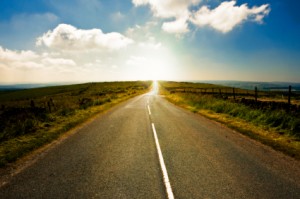 A winding country road going off into the distance and over a hill. West Yorkshire, England